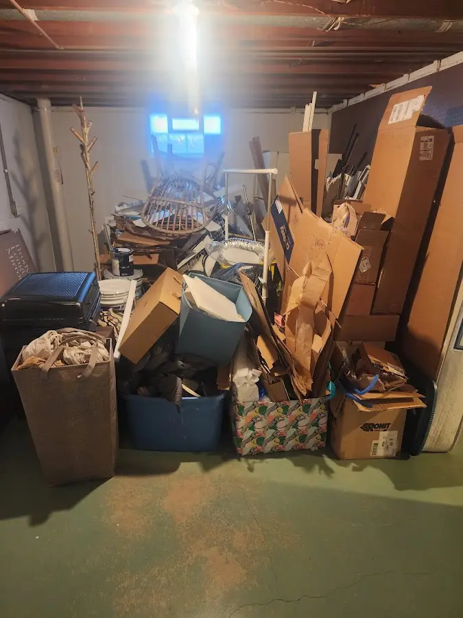 Roll-off dumpster container at job site for Yard Waste Dumpster Rental in Brookhaven