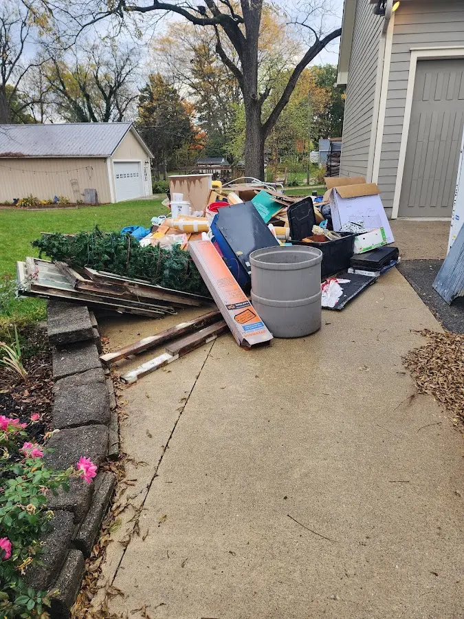 Dumpster being loaded with debris for 3 Yard Dumpster Rental in Brookhaven